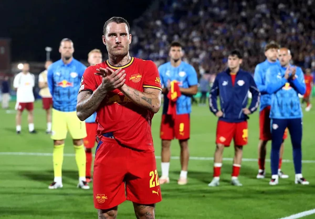 Player applauding with teammates in the background