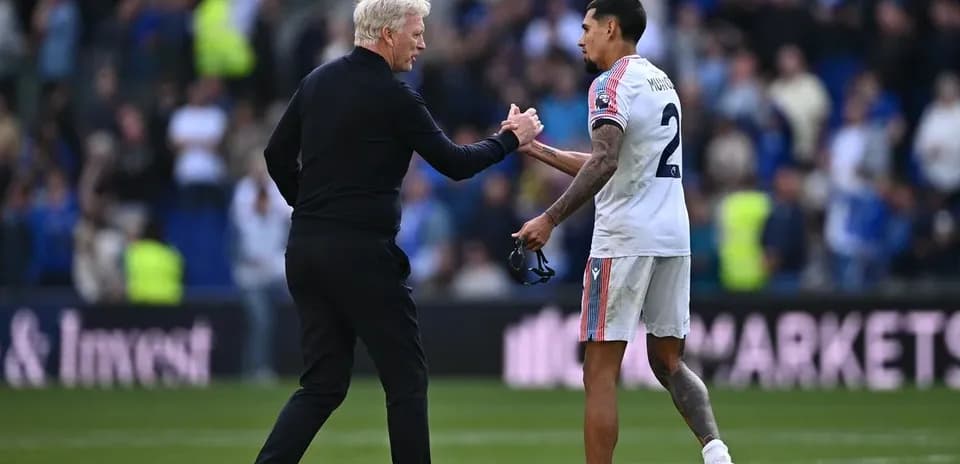 Manager shaking hands with player after match