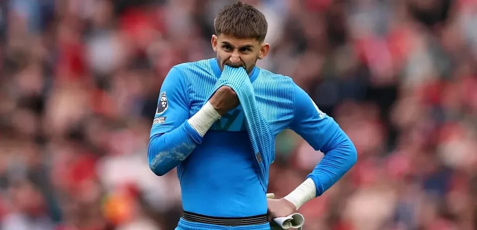 Goalkeeper biting his shirt during a match