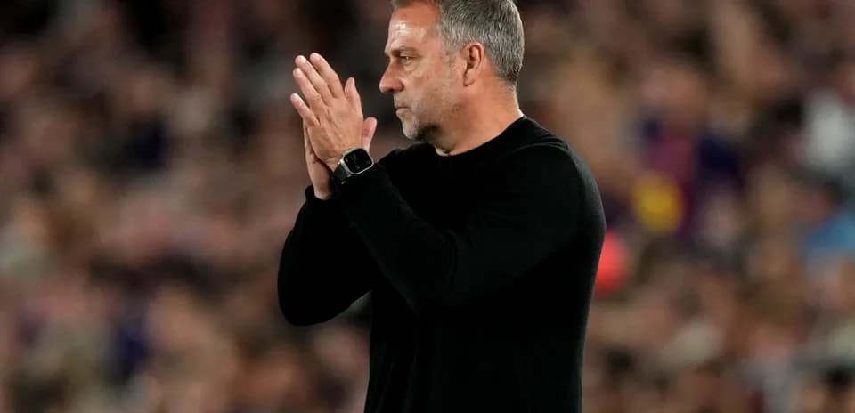 Coach applauding from the sidelines during match