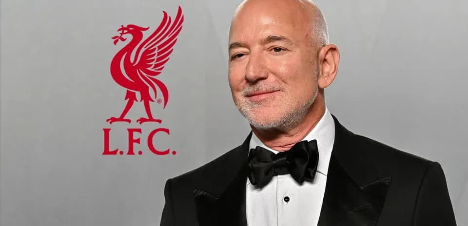 Person in tuxedo with Liverpool FC logo background