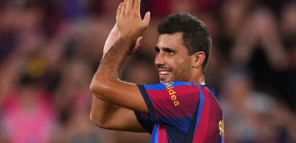 Player applauding fans during match celebration