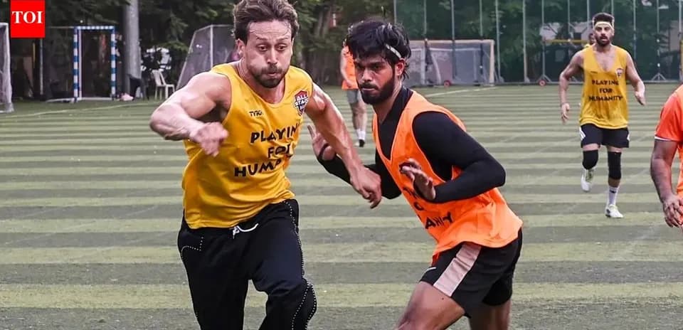 Two players sprinting during football training session
