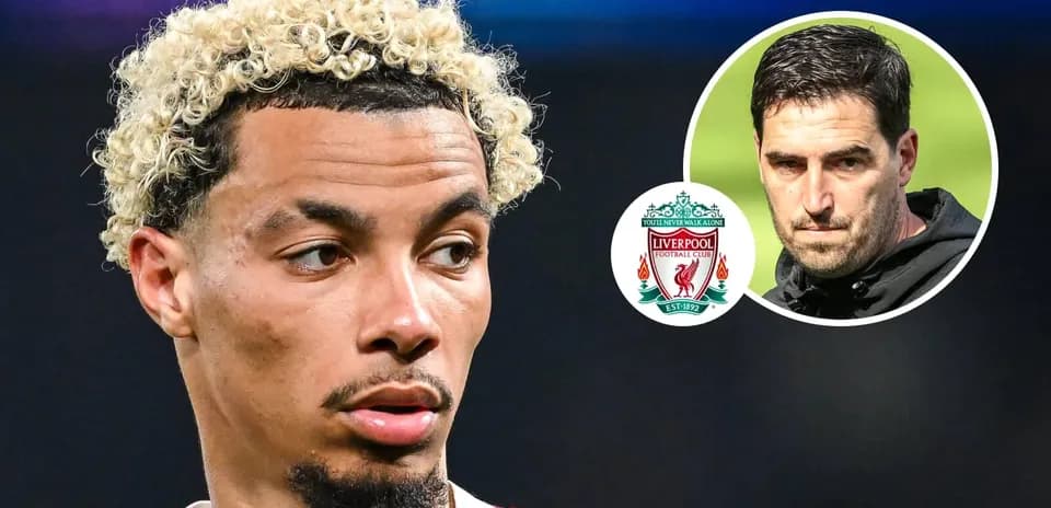 Player with curly hair near Liverpool logo and coach