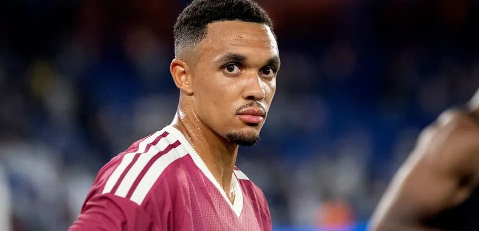Football player wearing maroon jersey on field