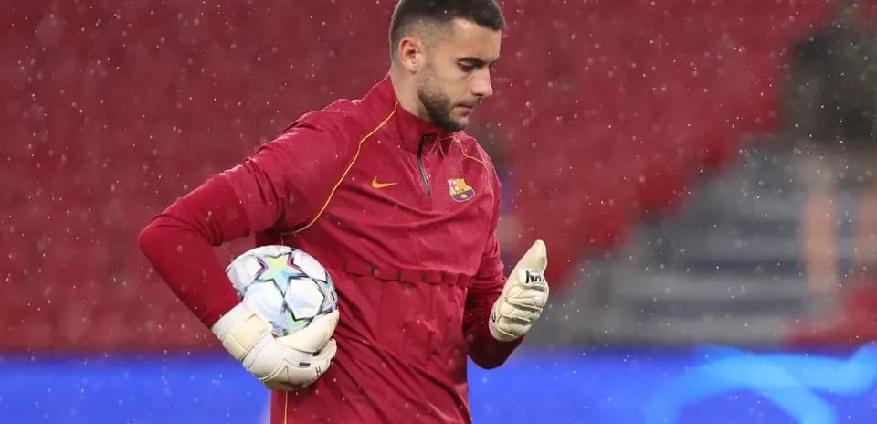Goalkeeper in training session holding a soccer ball