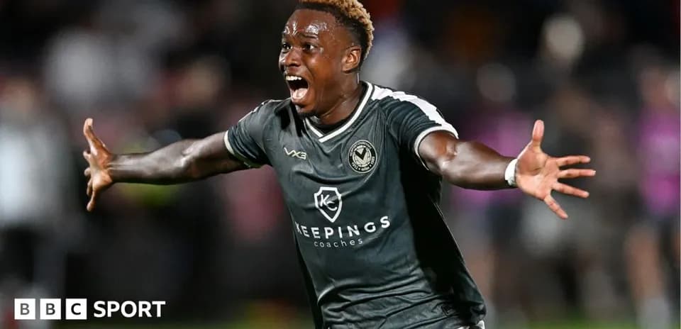 Player celebrating a goal in a football match