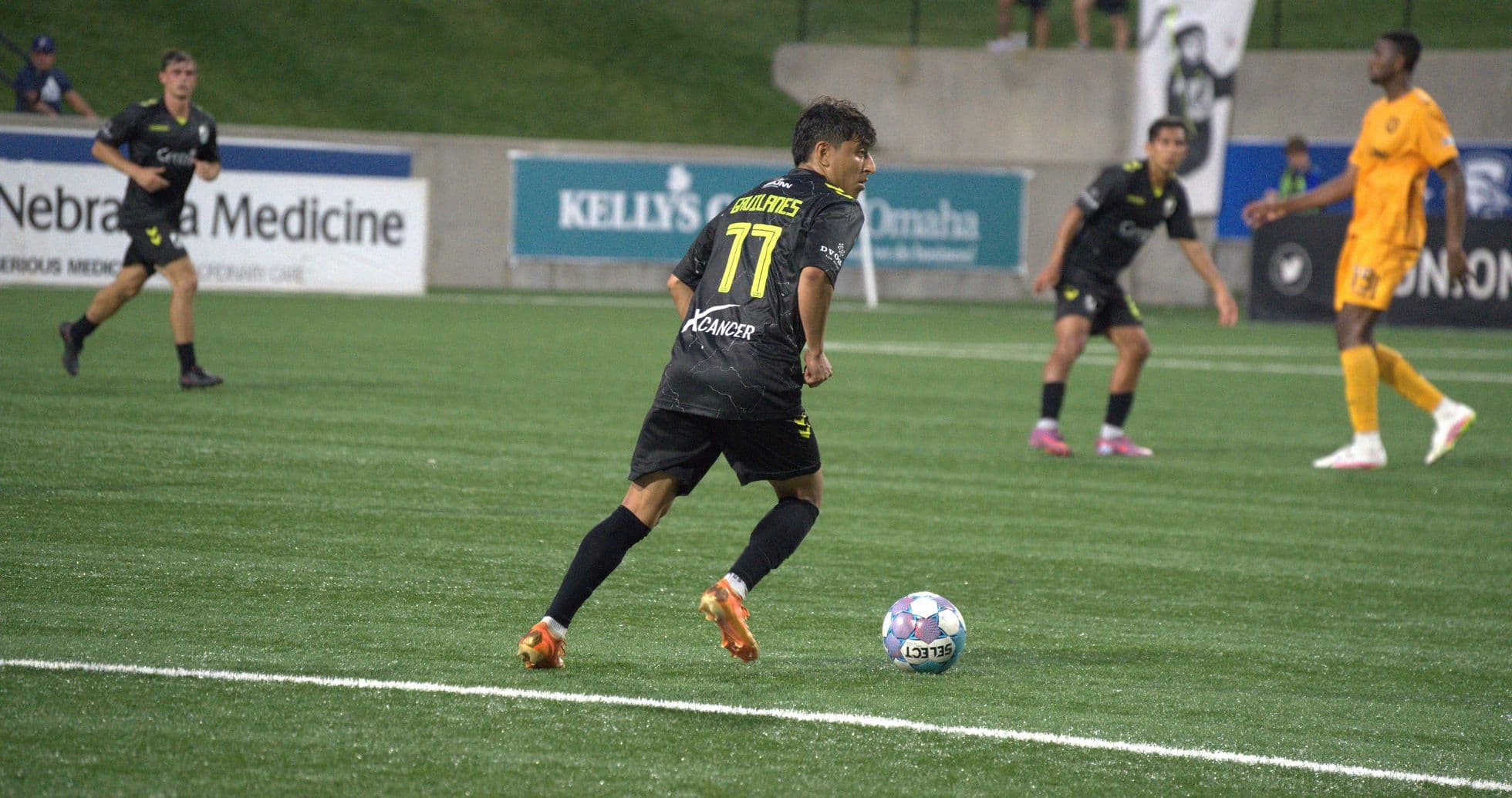 Player dribbling the ball during match action