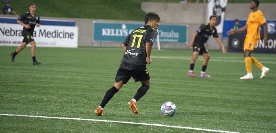 Player dribbling the ball during match action
