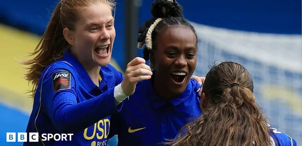 Players celebrating a goal during a match