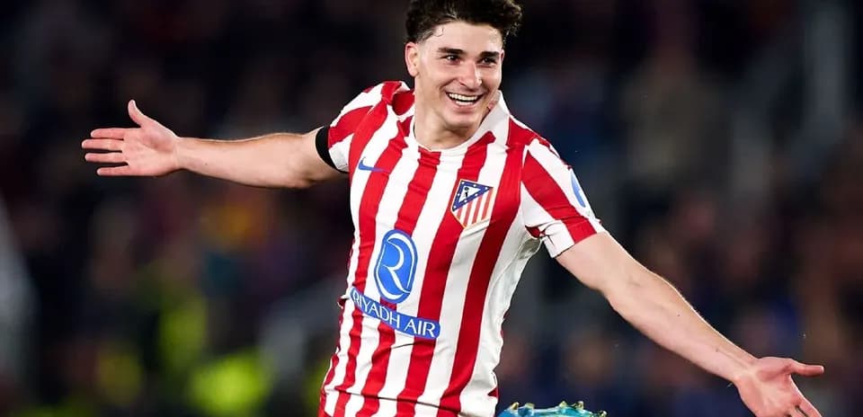 Player celebrating after scoring a goal for Atlético Madrid