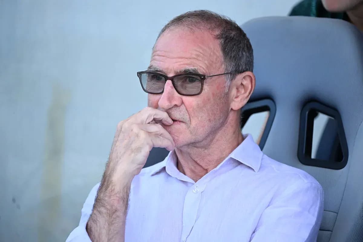 Man in glasses sitting on sports bench