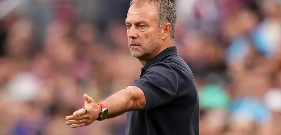 Coach gesturing on the sidelines during match
