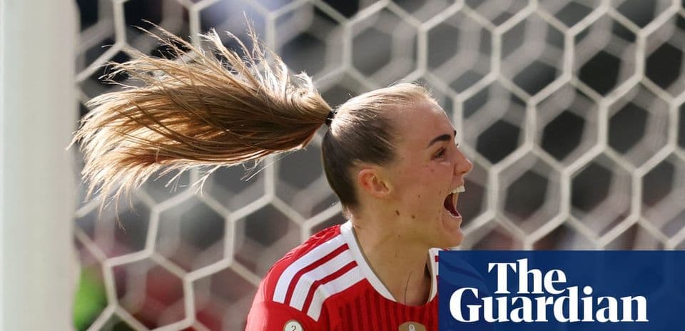 Goalkeeper celebrating with hair in ponytail