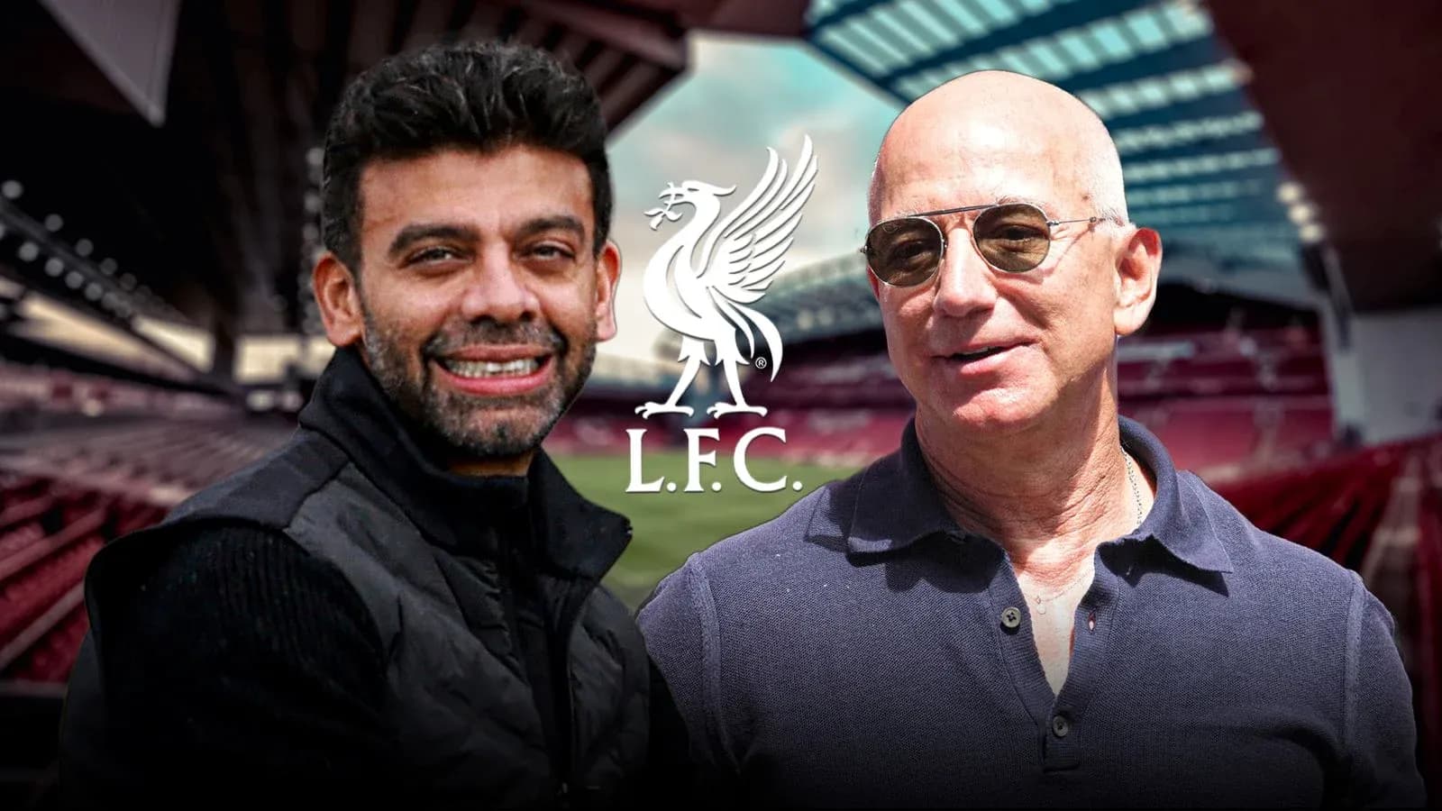 Two men posing at Liverpool FC stadium backdrop