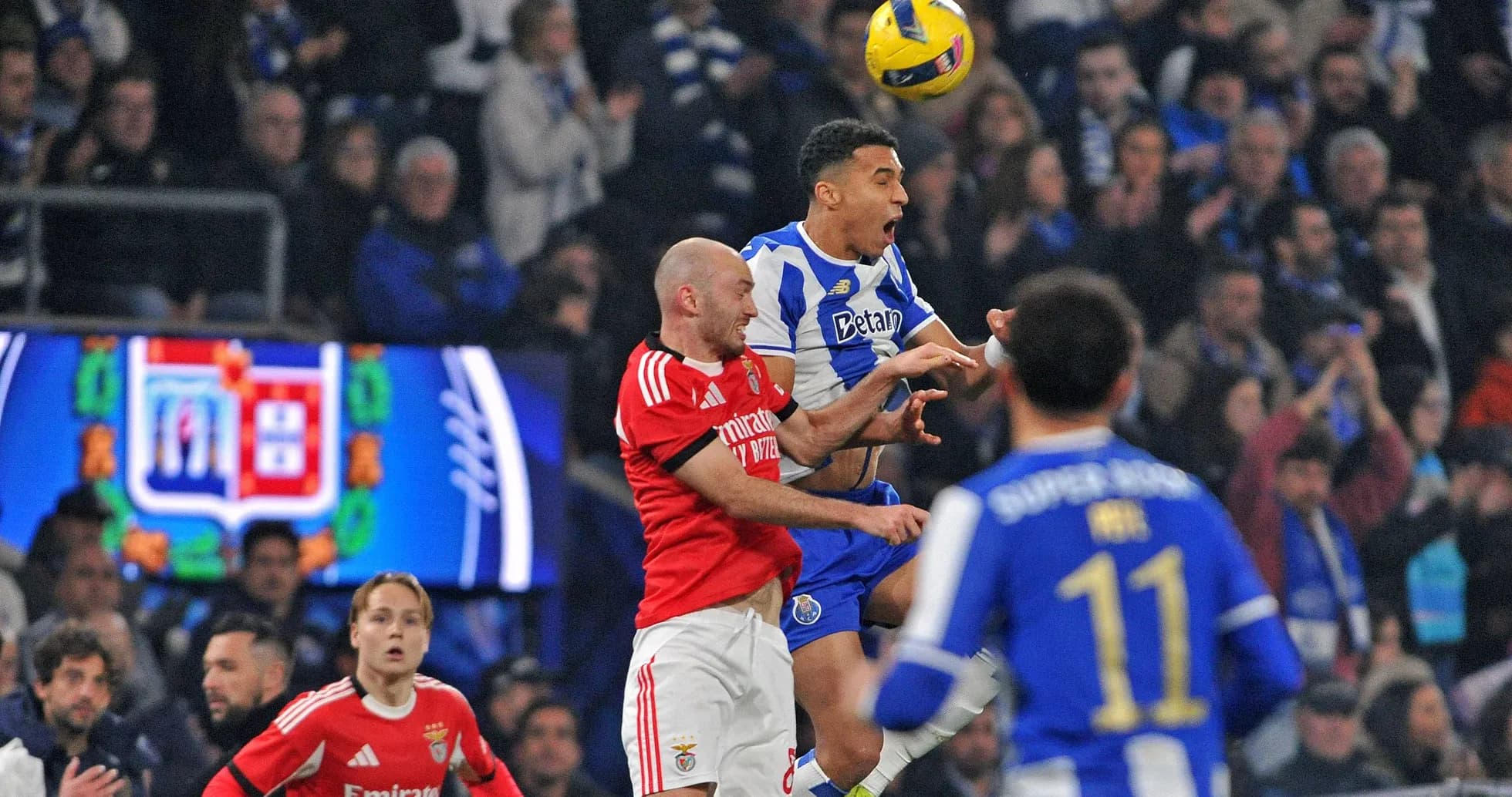 Players contesting a high ball during match