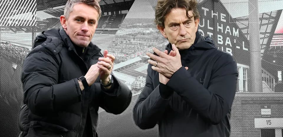 Two football managers applauding during a match