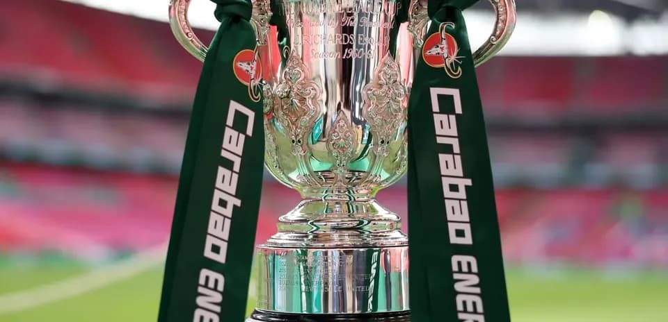 Carabao Cup trophy with green ribbons on display