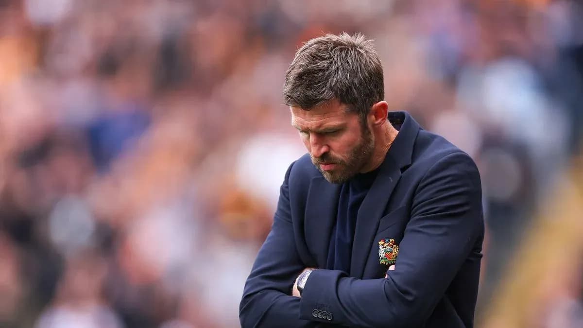 Coach with arms crossed during match contemplation