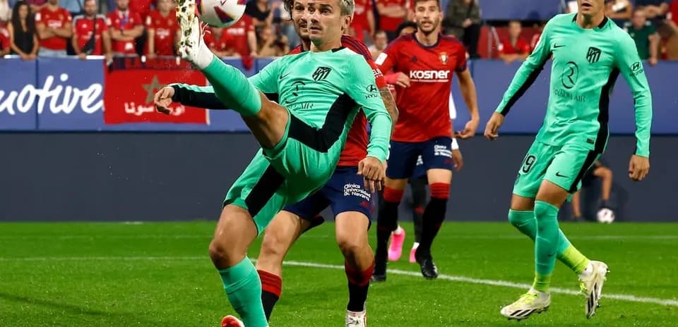 Atletico Madrid player attempting a bicycle kick