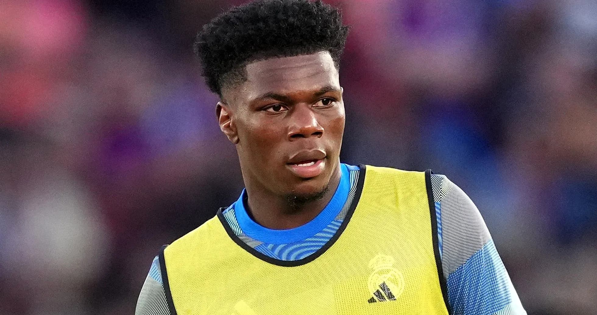 Player wearing training gear during match warm-up