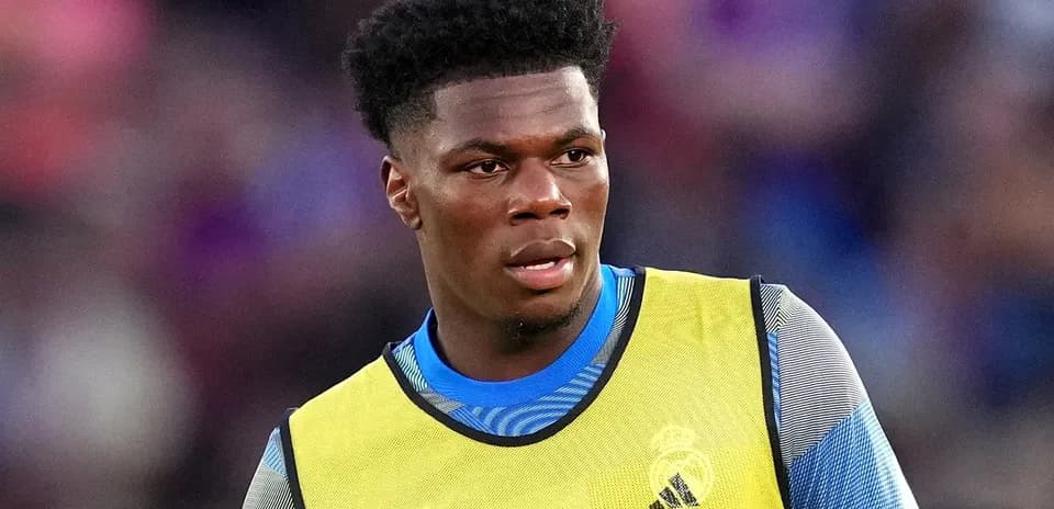Player wearing training gear during match warm-up