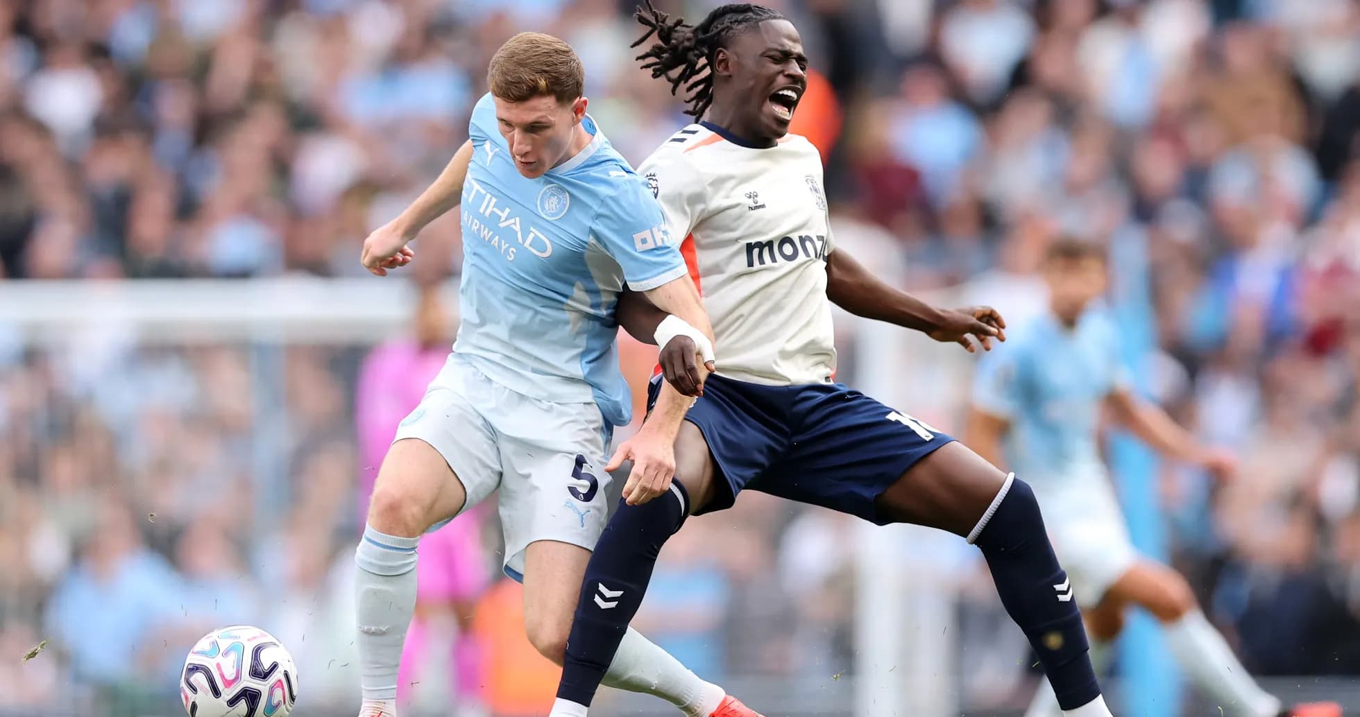 Manchester City player tackles Coventry opponent
