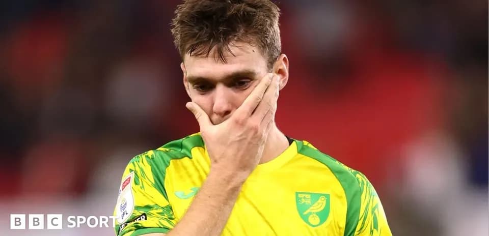 Player in yellow kit looking disappointed after match