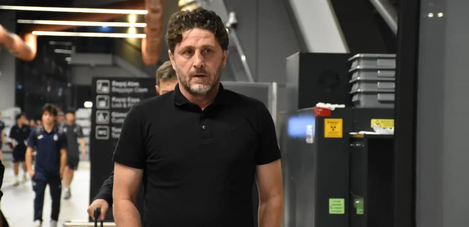 Man walking through an airport terminal