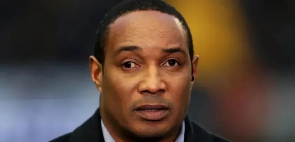 Man with serious expression speaking off-camera