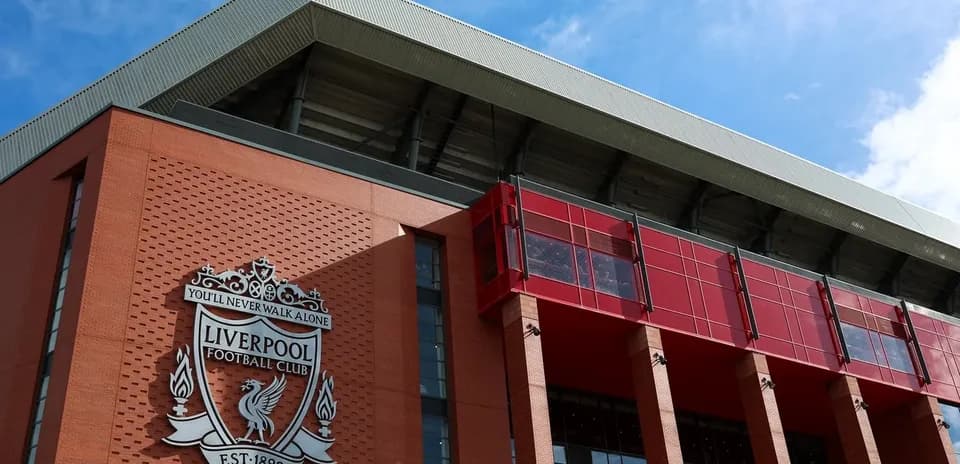 Liverpool Football Club emblem on stadium facade