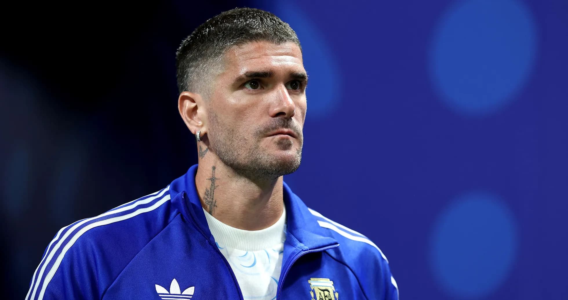 Player in blue tracksuit before match