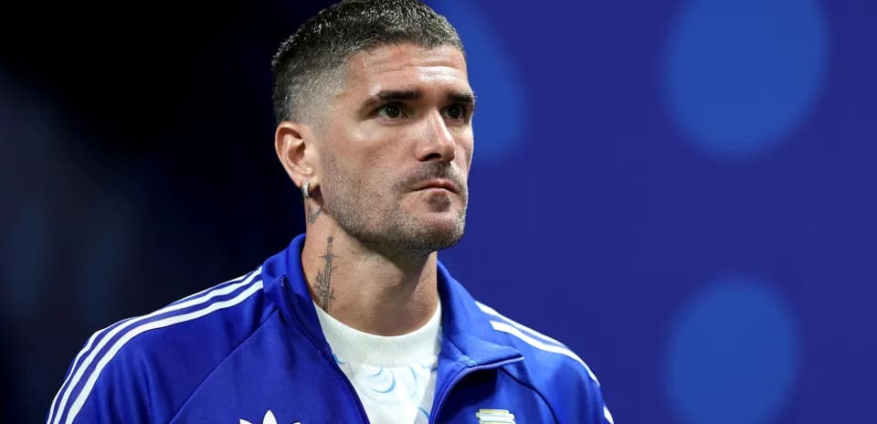 Player in blue tracksuit before match