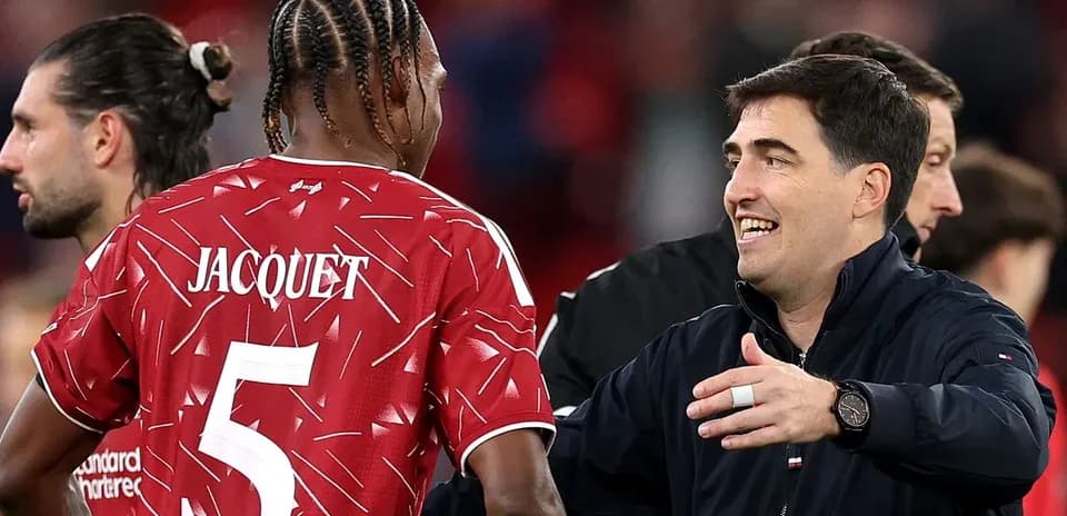 Player Jacquet interacting with coach after match