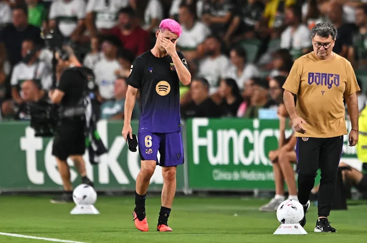 Player with pink hair walking off the field