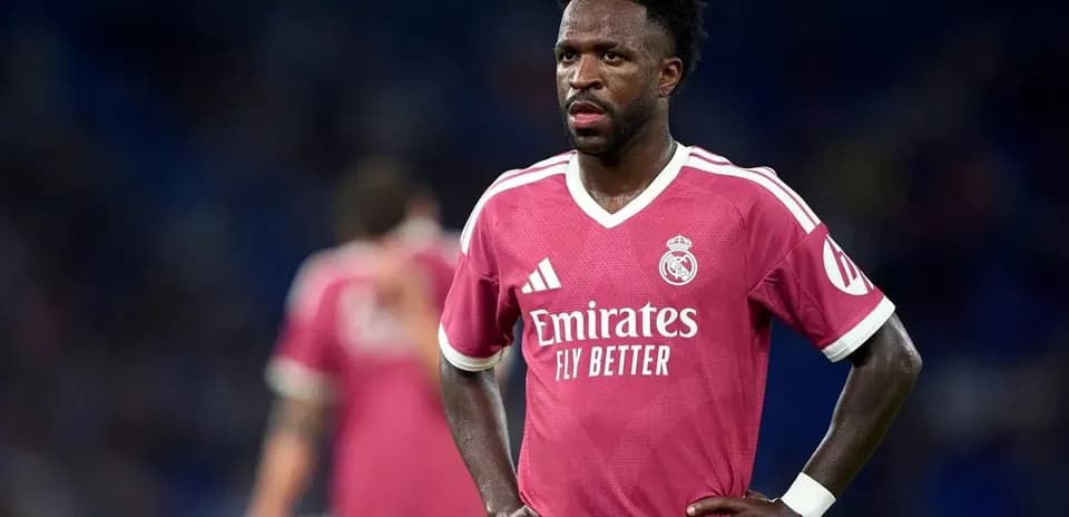 Player in pink Real Madrid kit on the field