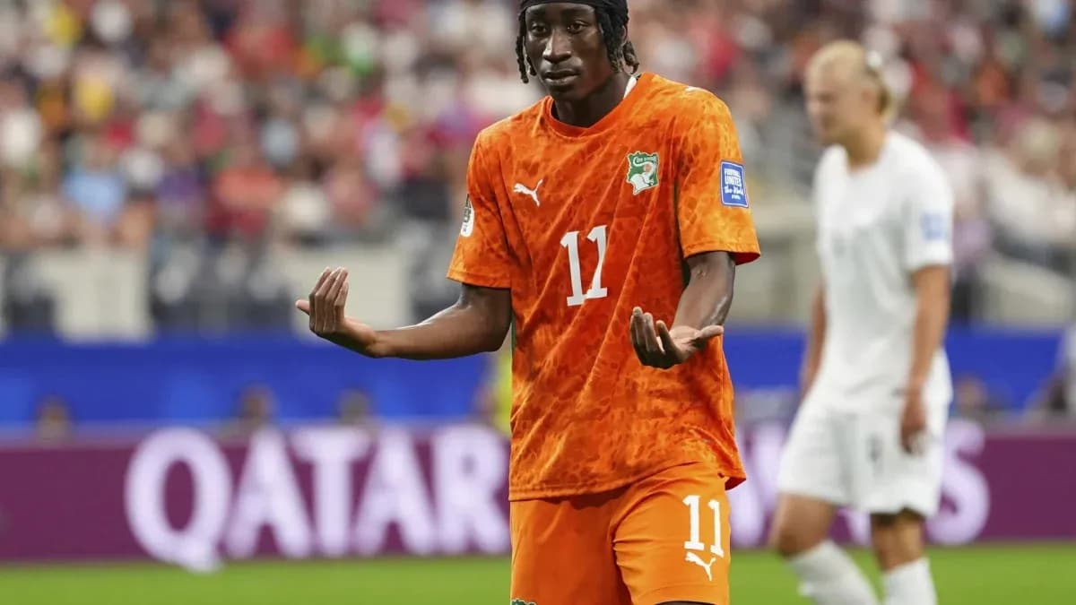 Ivorian player gesturing during a soccer match Ivorian player gesturing during a soccer match
