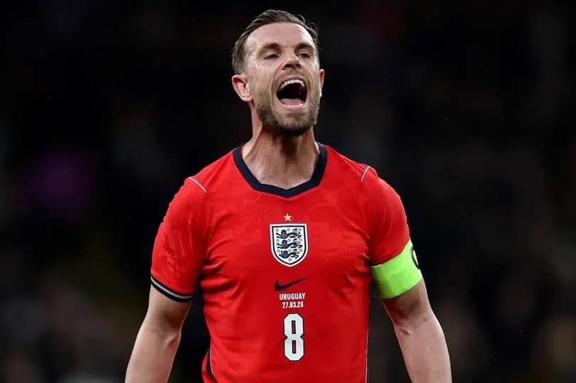 Player celebrating in England jersey with captain's armband Player celebrating in England jersey with captain's armband