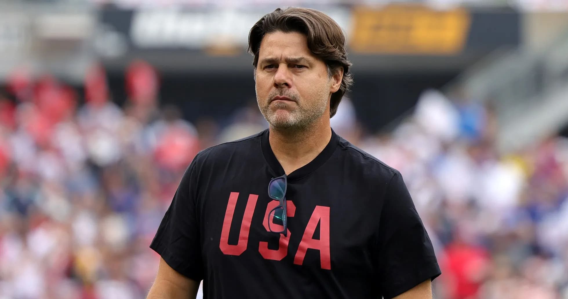 Coach walking on the field during a match Coach walking on the field during a match