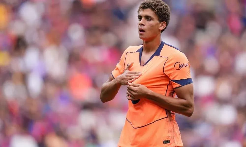 Player in orange jersey during match warm-up Player in orange jersey during match warm-up