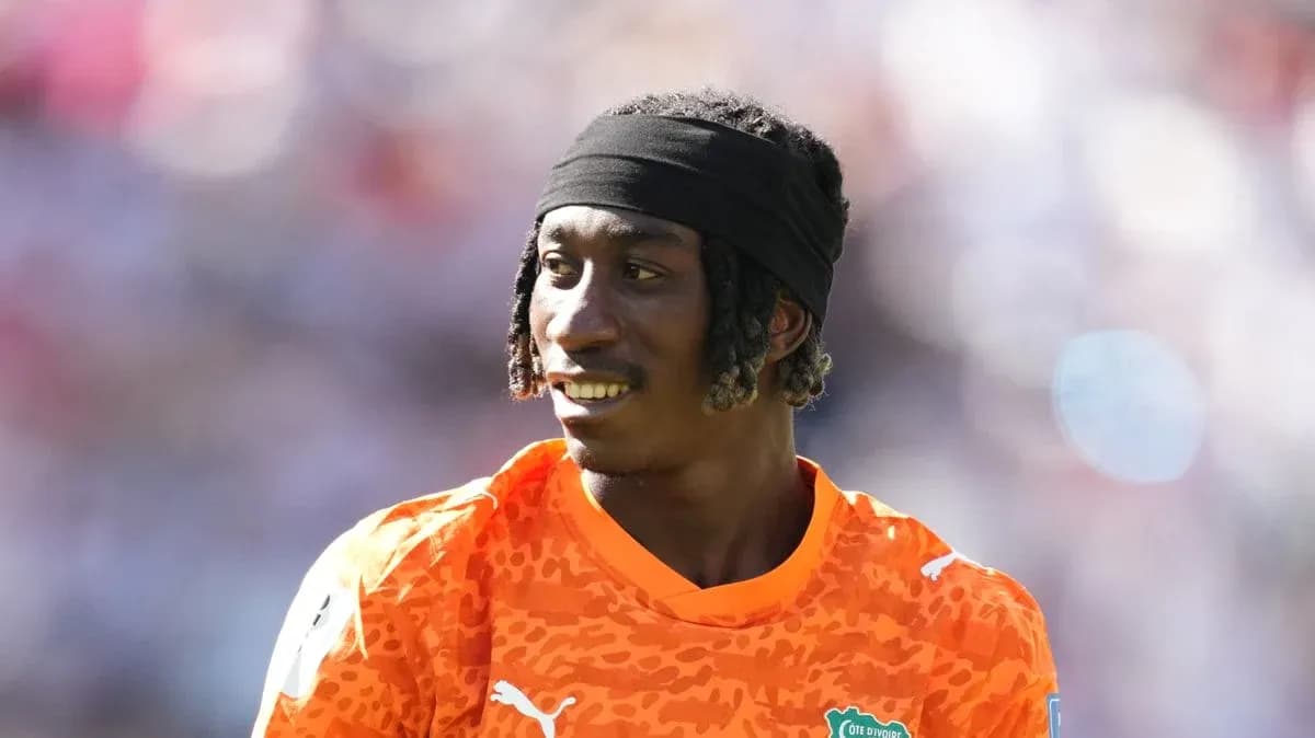 Goalkeeper in orange kit during match warm-up Goalkeeper in orange kit during match warm-up