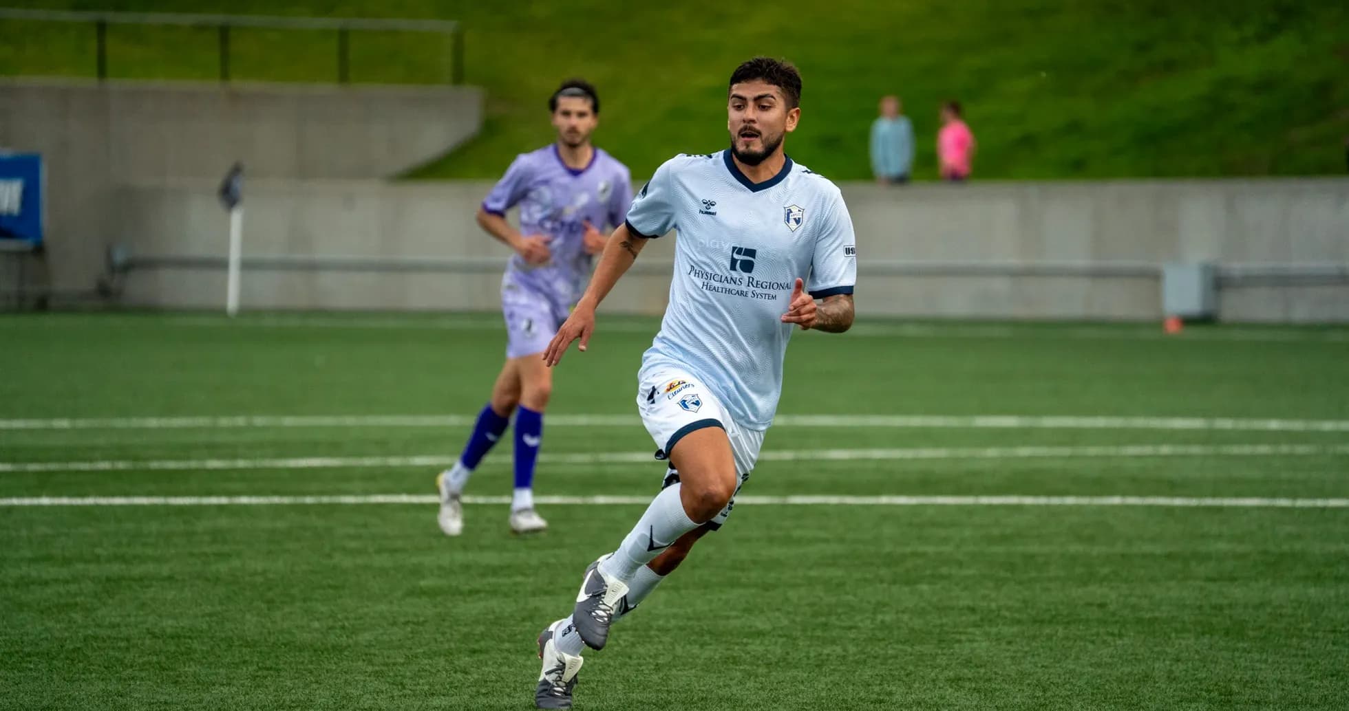 Player running during Naples vs Sarasota Paradise match Player running during Naples vs Sarasota Paradise match
