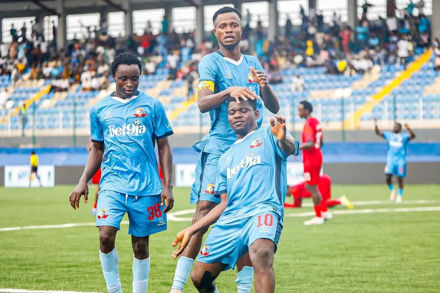 Niger Tornadoes players celebrating a goal Niger Tornadoes players celebrating a goal