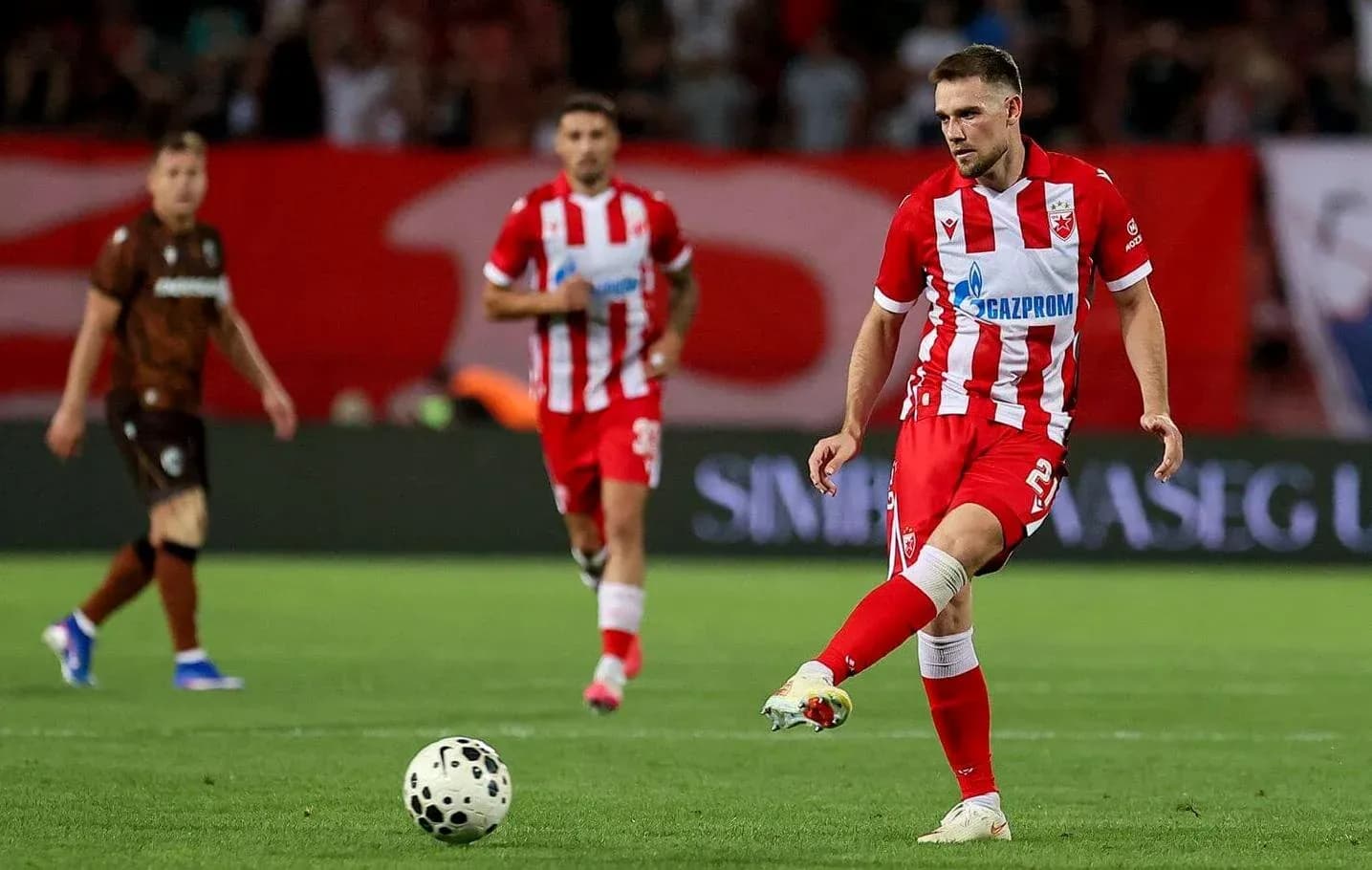 FK Crvena Zvezda player taking a free kick FK Crvena Zvezda player taking a free kick