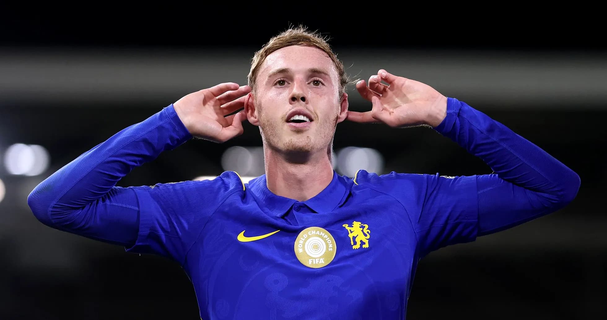 Player celebrating with hands to ears after scoring Player celebrating with hands to ears after scoring