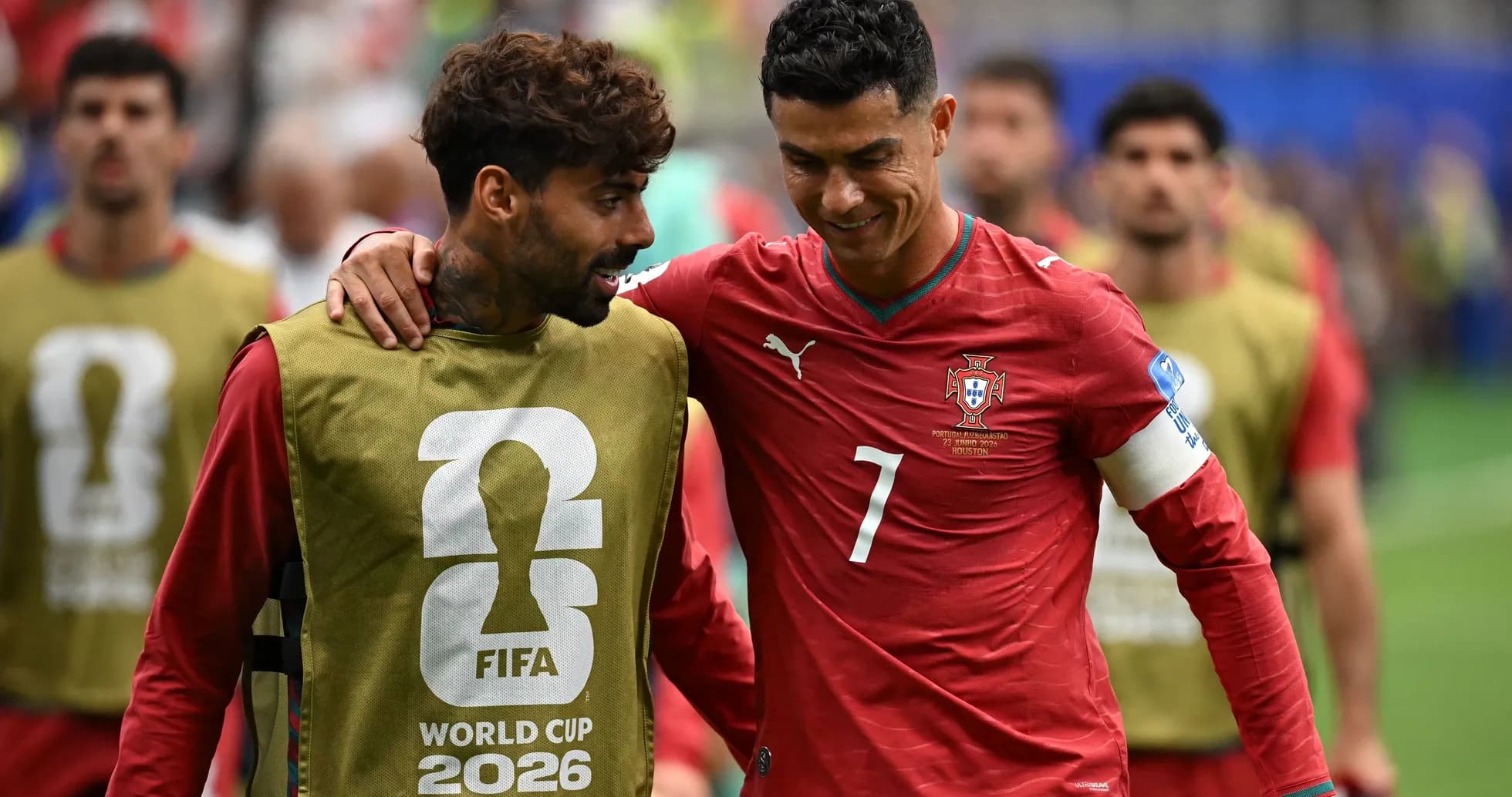 Two Portugal players walking off the pitch together Two Portugal players walking off the pitch together