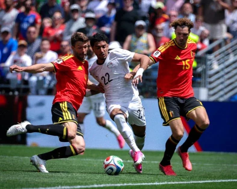 Players from Egypt and Belgium contesting for the ball Players from Egypt and Belgium contesting for the ball