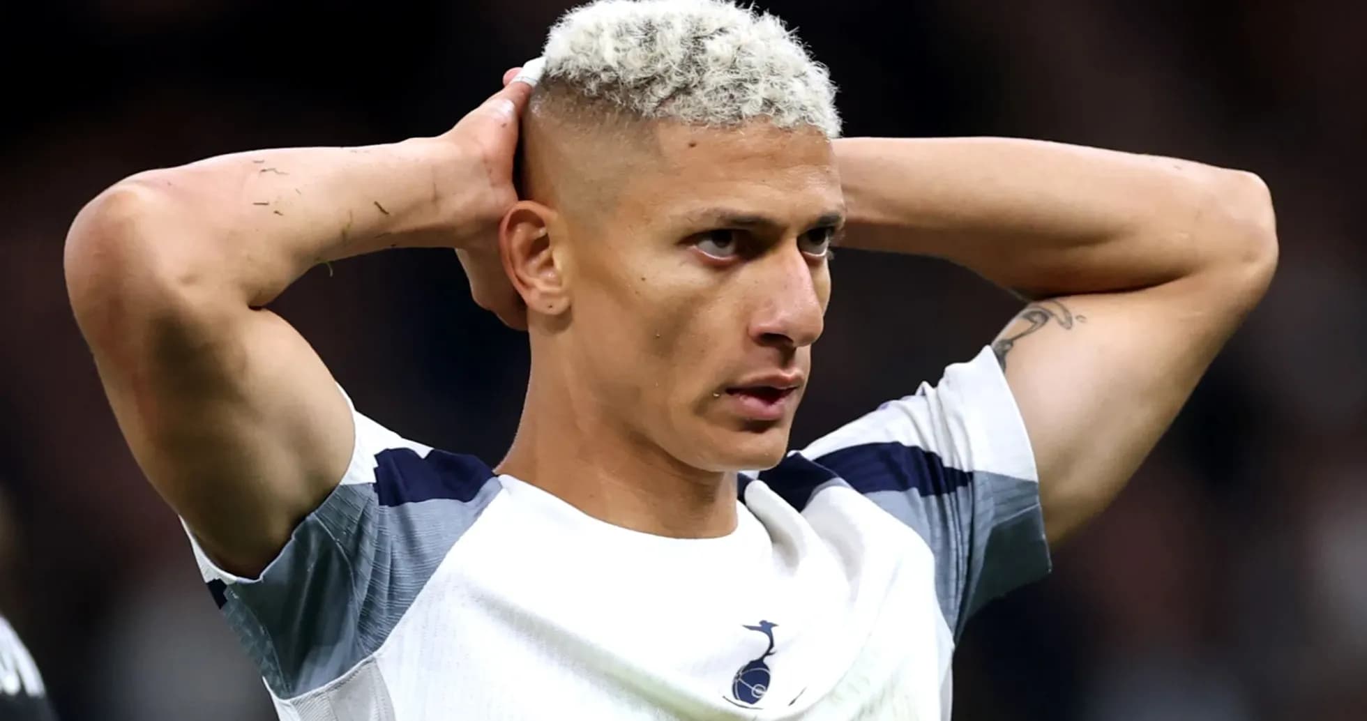 Player holding head in frustration during match Player holding head in frustration during match