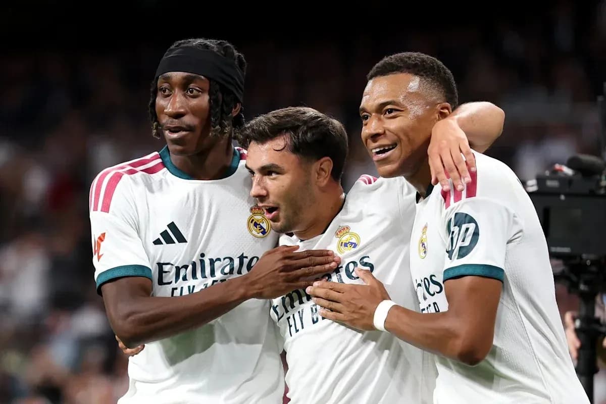 Three Real Madrid players celebrating together Three Real Madrid players celebrating together