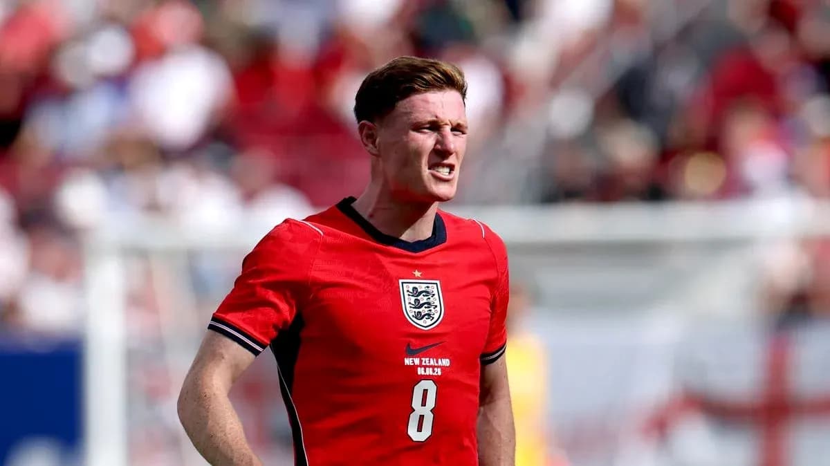 Player in red jersey during a soccer match Player in red jersey during a soccer match
